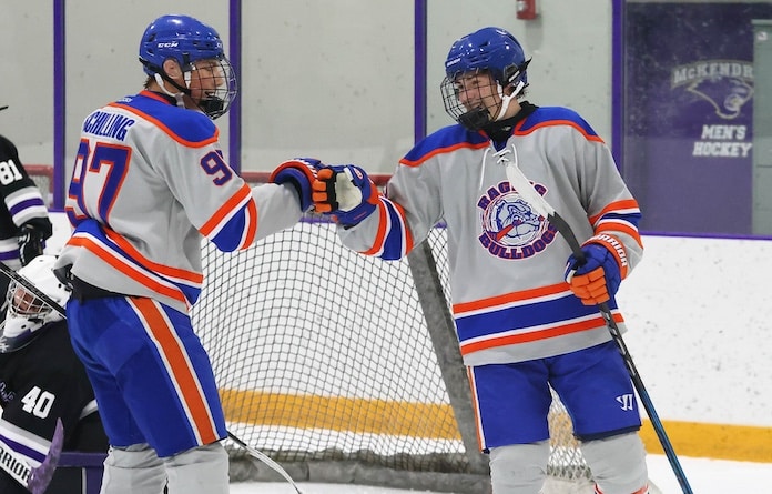 Kole Schilling (97) and Ryder Neff (9) of Waterloo fist bump after a goal against Collinsville in a MVCHS hockey game at the McKendree Metro Rec Plex on Thursdsay, December 5, 2024 Paul Baillargeon