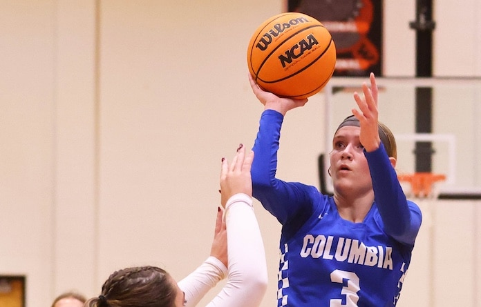 Sam Schmuke (3) of Columbia lifts a shot towards the net against Waterloo at the Waterlooo Holiday Tournament at Waterloo High School on Thursday, December 27, 2024. Paul Baillargeon