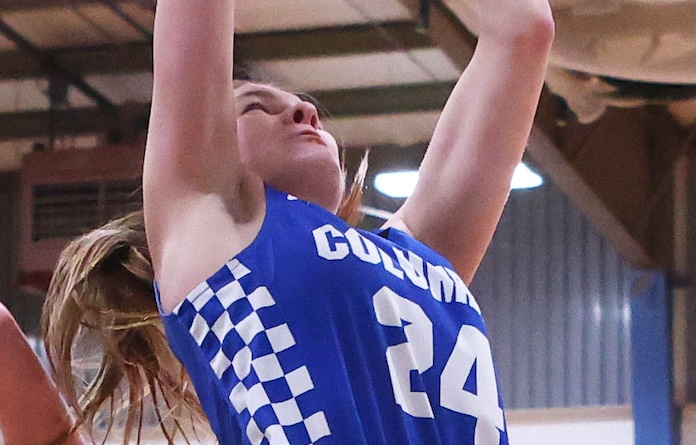 Ava Mathews (24) of Columbia goes up for the shot against Gibault at the Candy Cane Classic girls Christmas Tournament at Gibault Catholic High School on Saturday, December 21, 2024. Paul Baillargeon