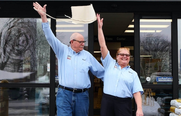 Paul and Mary (Vogel)  Braner celebrate their retirement by throwing their aprons into the air as they as they walk away from Lee's Home Center. Paul put in 39 yearsa nd Mary 46 years service. Paul Baillargeon